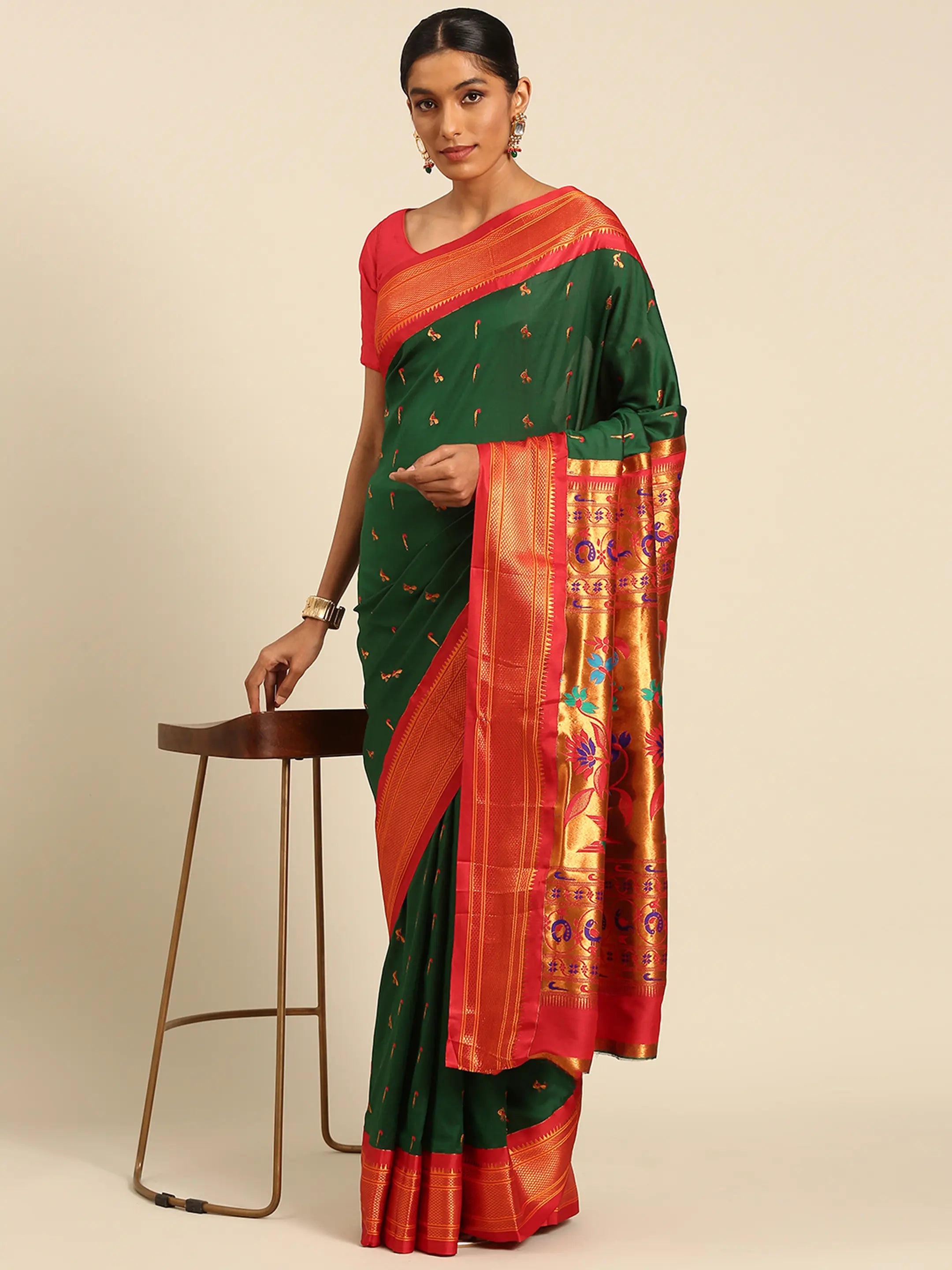 Muniya paithani saree silk blend in bottle green and red with muniya peacock meena butti - styled model view for wedding wear