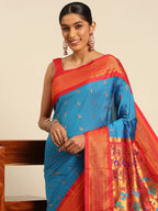 Muniya paithani saree silk blend in firozi and red with muniya peacock meena butti - closeup view showing fabric and zari work for wedding wear