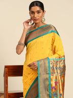 Muniya paithani saree silk blend in gold and rama with muniya peacock meena butti - closeup view showing fabric and zari work for wedding wear