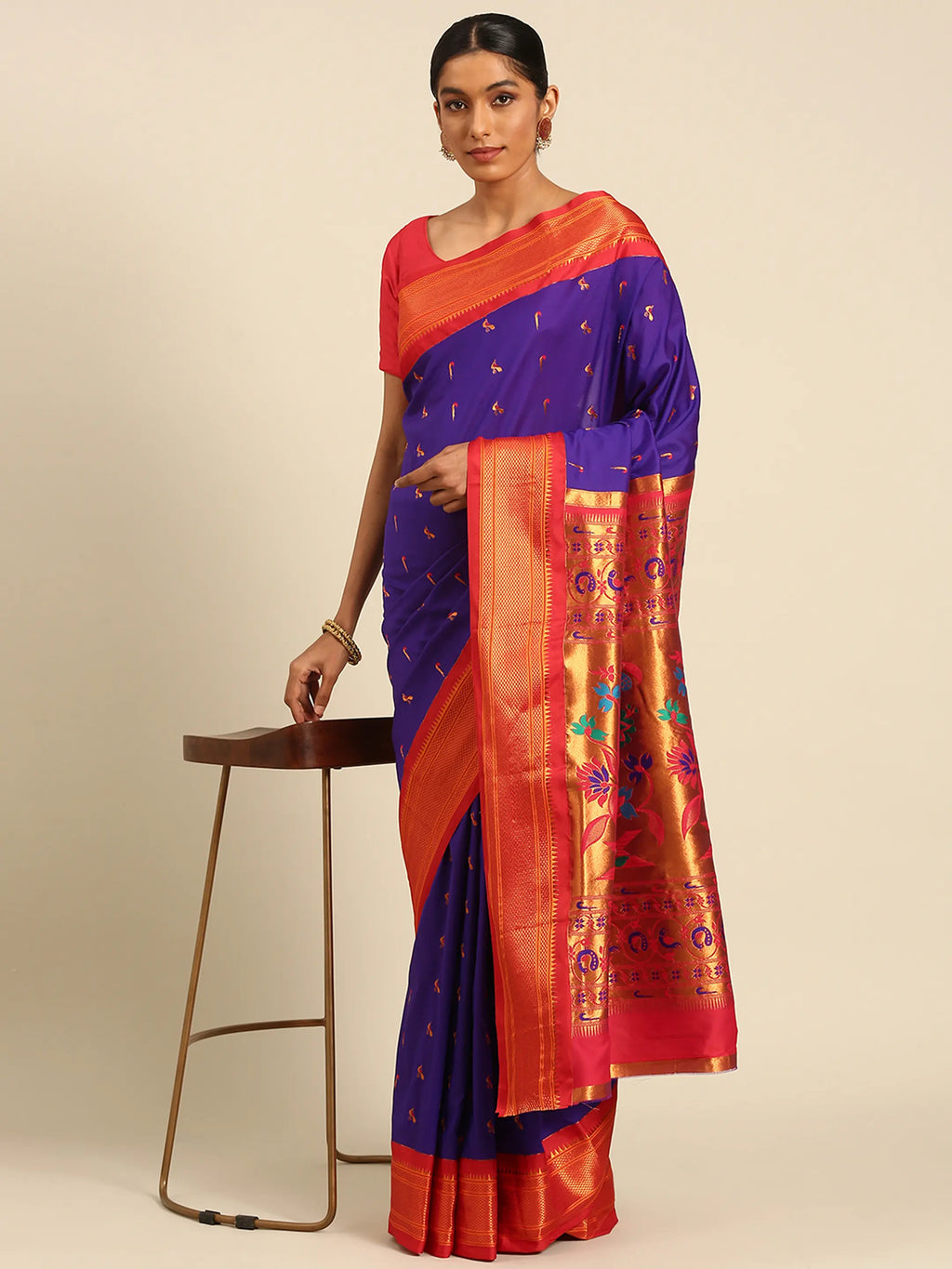 Muniya paithani saree silk blend in indigo blue and red with muniya peacock meena butti - styled model view for wedding wear