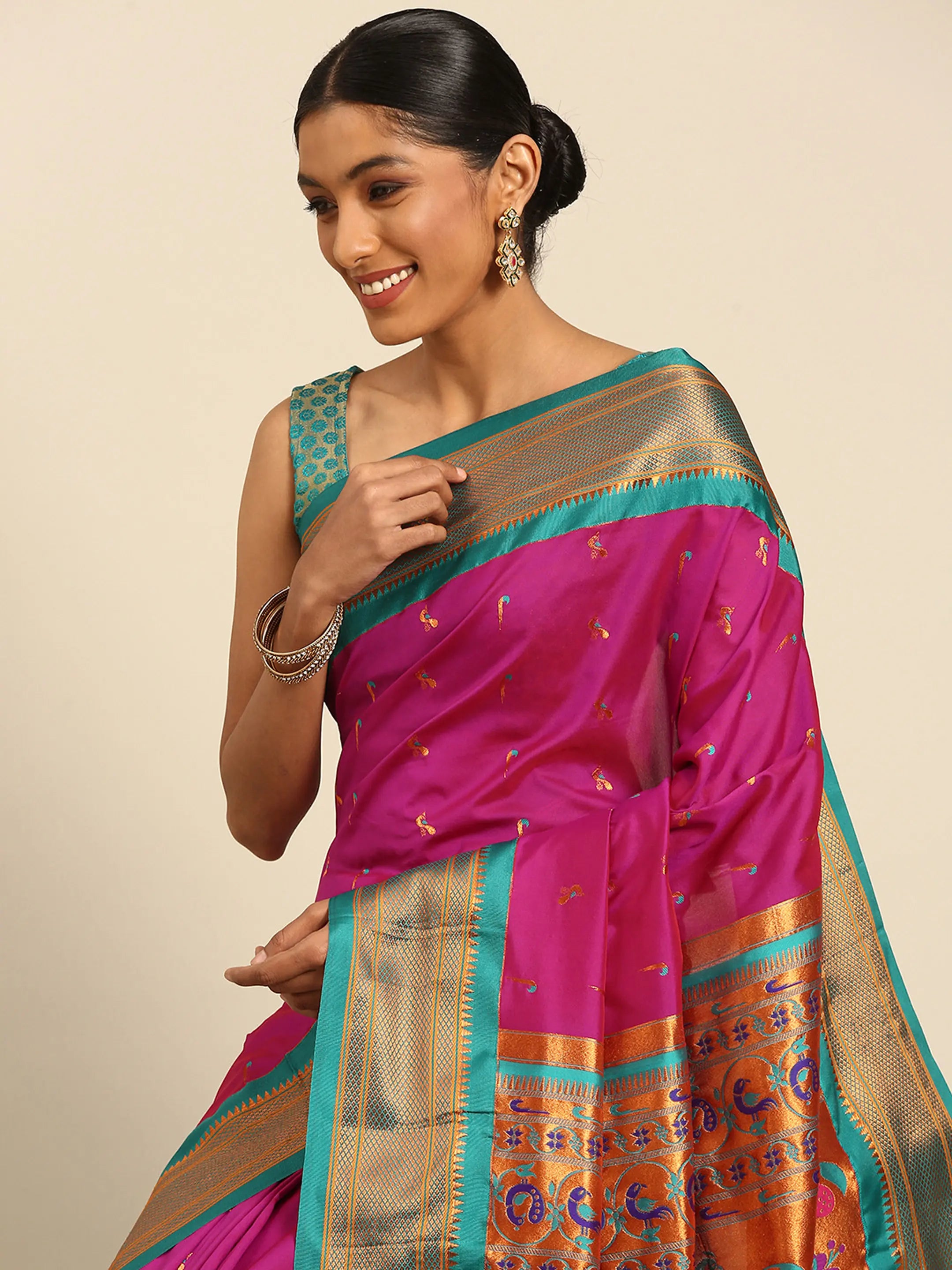Muniya paithani saree silk blend in magenta and rama with muniya peacock meena butti - closeup view showing fabric and zari work for wedding wear