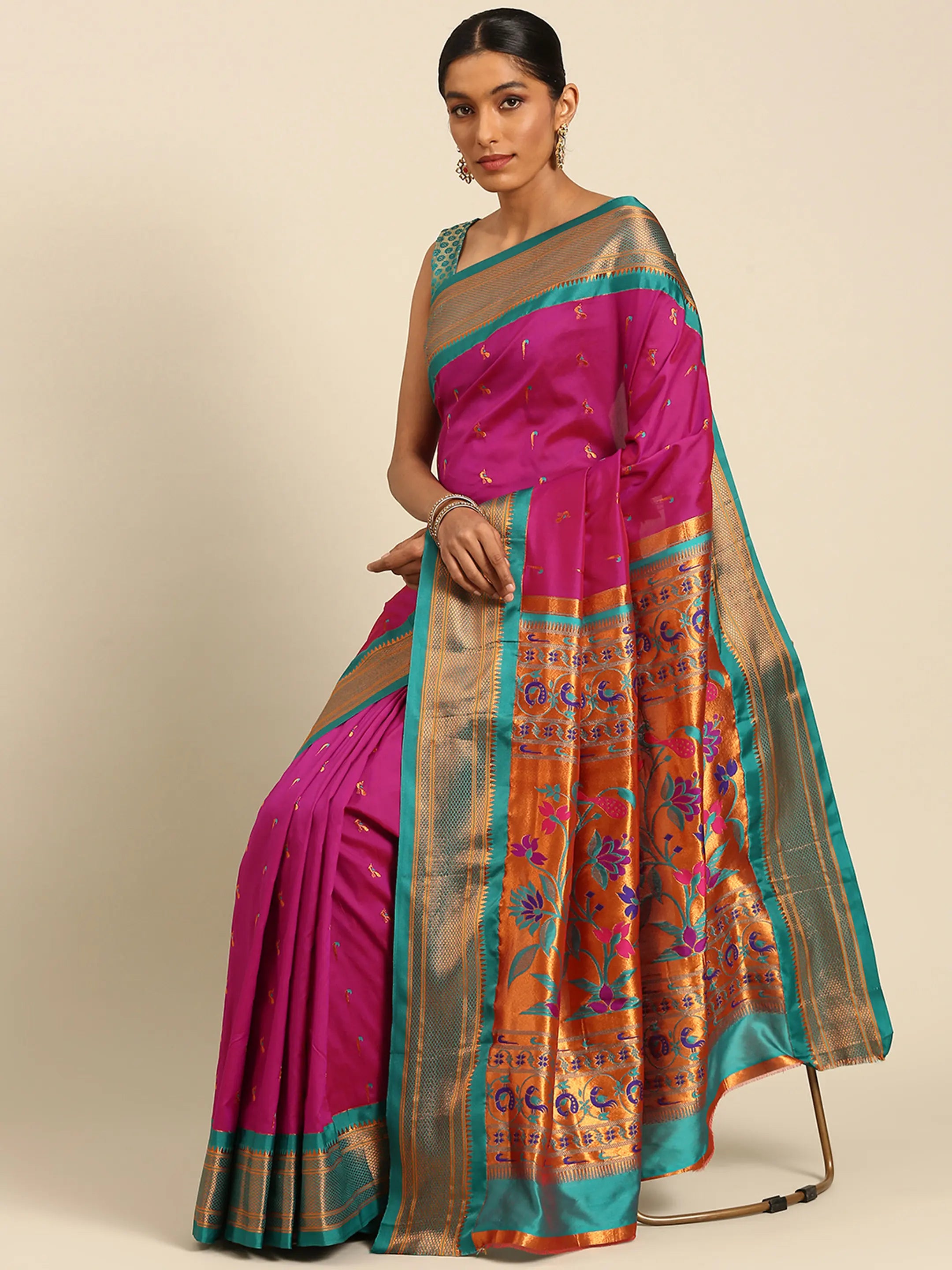 Muniya paithani saree silk blend in magenta and rama with muniya peacock meena butti - styled model view for wedding wear