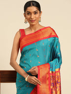 Muniya paithani saree silk blend in rama green and red with muniya peacock meena butti - closeup view showing fabric and zari work for wedding wear
