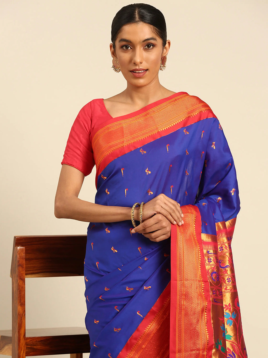 Muniya paithani saree silk blend in royal blue and red with muniya peacock meena butti - closeup view showing fabric and zari work for wedding wear