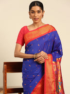 Muniya paithani saree silk blend in royal blue and red with muniya peacock meena butti - closeup view showing fabric and zari work for wedding wear