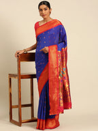 Muniya paithani saree silk blend in royal blue and red with muniya peacock meena butti - styled model view for wedding wear