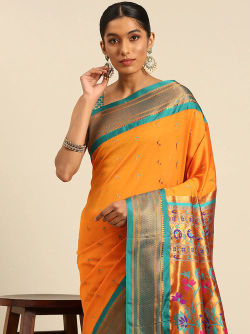 Muniya paithani saree soft silk in saffron and rama with muniya peacock meena butti - closeup view showing fabric and zari work for wedding wear