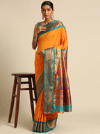 Muniya paithani saree silk blend in saffron and rama with muniya peacock meena butti - styled model view for wedding wear