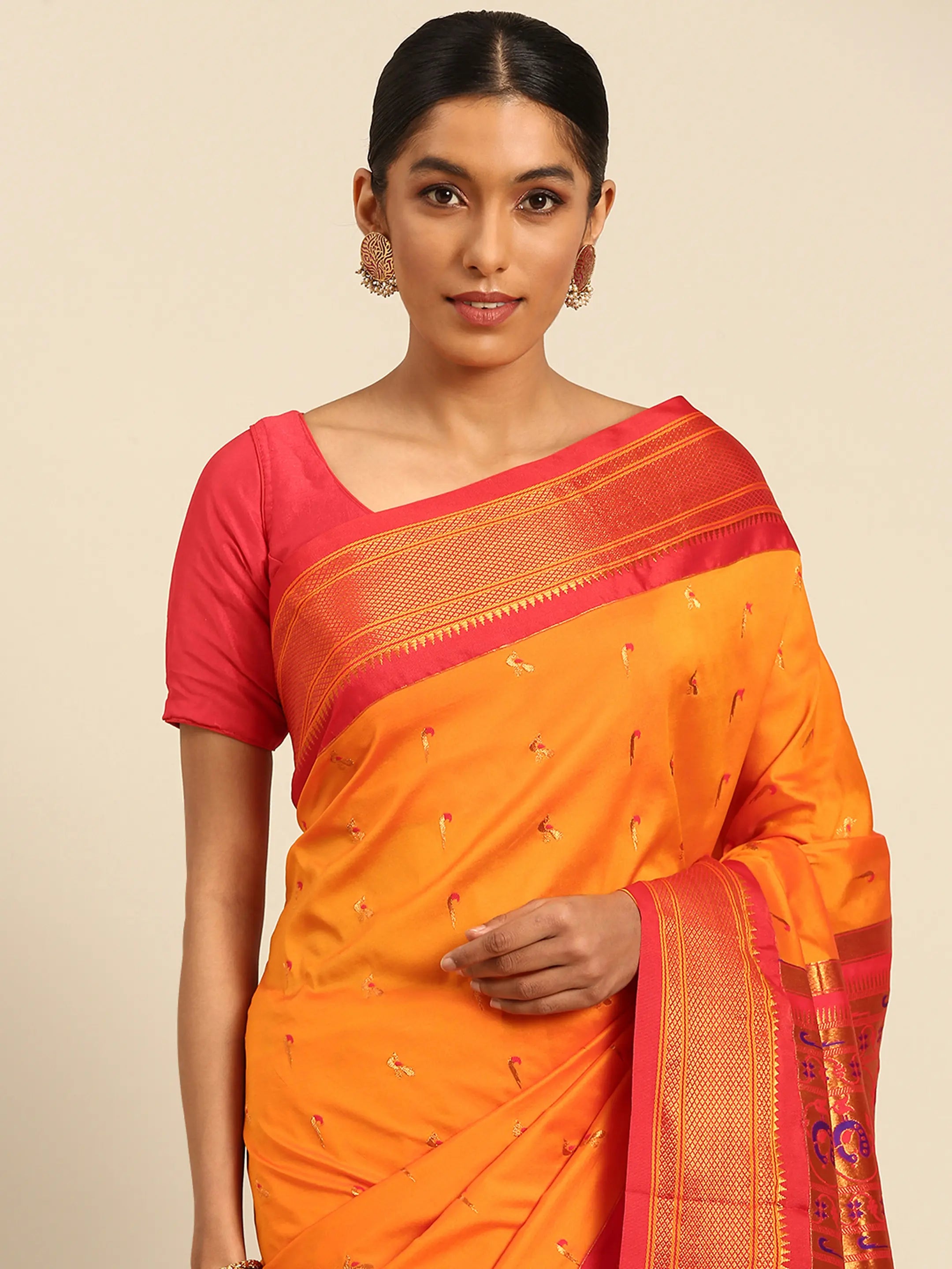 Muniya paithani saree silk blend in saffron and red with muniya peacock meena butti - closeup view showing fabric and zari work for wedding wear