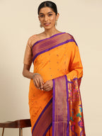 Muniya paithani saree silk blend in saffron and violet with muniya peacock meena butti - closeup view showing fabric and zari work for wedding wear