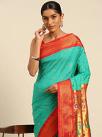 Muniya paithani saree silk blend in sea green and red with muniya peacock meena butti - closeup view showing fabric and zari work for wedding wear