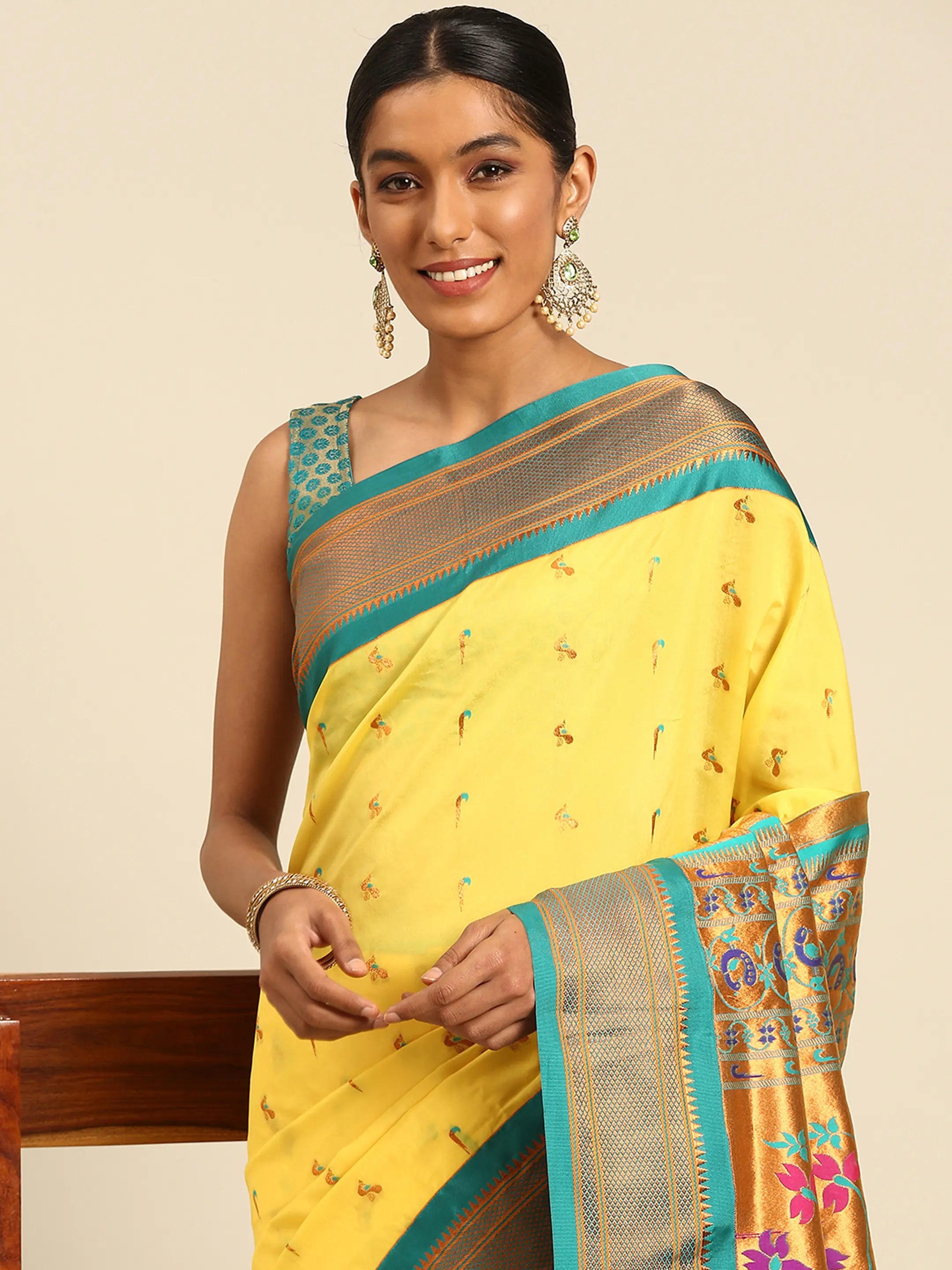 Muniya paithani saree silk blend in yellow and rama with muniya peacock meena butti - closeup view showing fabric and zari work for wedding wear