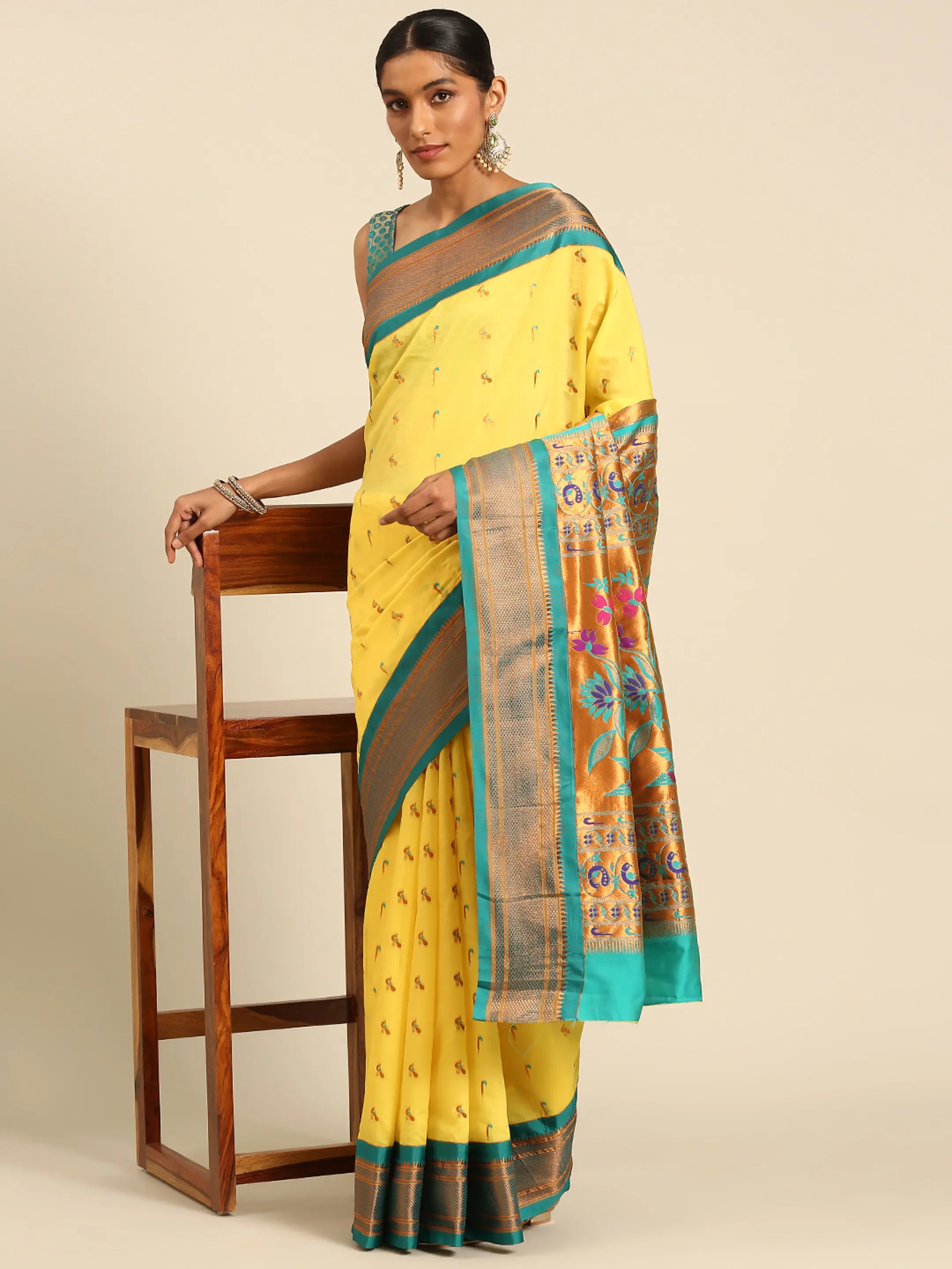 Muniya paithani saree silk blend in yellow and rama with muniya peacock meena butti - styled model view for wedding wear