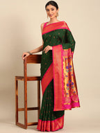 Muniya paithani saree silk blend in bottle green and pink with parrot motif zari work - styled model view for wedding wear
