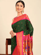 Muniya paithani saree silk blend in bottle green and pink with parrot motif zari work - closeup view showing fabric and zari work for wedding wear