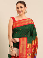 Muniya paithani saree silk blend in bottle green and red with parrot motif zari work - closeup view showing fabric and zari work for wedding wear