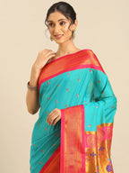Muniya paithani saree silk blend in chintamani and pink with parrot motif zari work - closeup view showing fabric and zari work for wedding wear