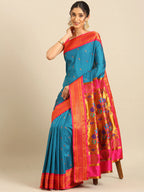 Muniya paithani saree silk blend in firozi and pink with parrot motif zari work - styled model view for wedding wear
