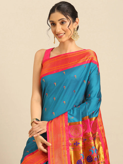 Muniya paithani saree soft silk in firozi and pink with parrot motif zari work - closeup view showing fabric and zari work for wedding wear