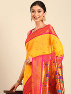 Muniya paithani saree silk blend in gold and pink with parrot motif zari work - closeup view showing fabric and zari work for wedding wear