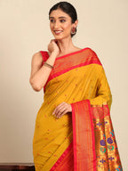 Muniya paithani saree silk blend in mustard yellow and red with parrot motif zari work - closeup view showing fabric and zari work for wedding wear