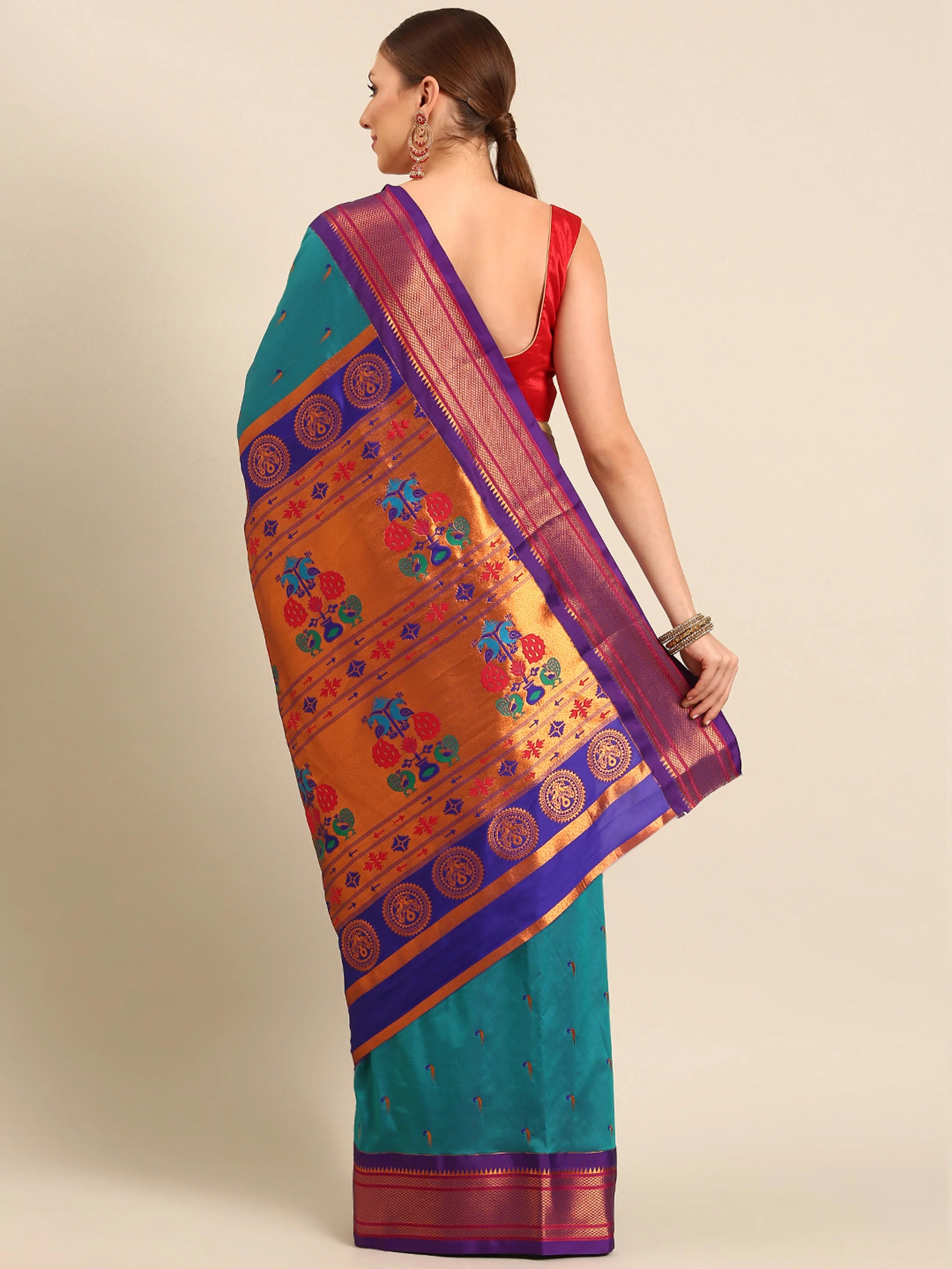 Muniya paithani saree silk blend in rama green and violet with parrot motif zari work - back view showing pallu and border for wedding wear