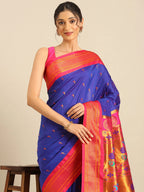 Muniya paithani saree silk blend in royal blue and pink with parrot motif zari work - closeup view showing fabric and zari work for wedding wear