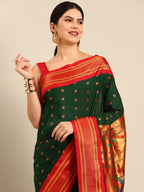 Muniya paithani saree silk blend in bottle green and red with floral meena butti - closeup view showing fabric and zari work for wedding wear