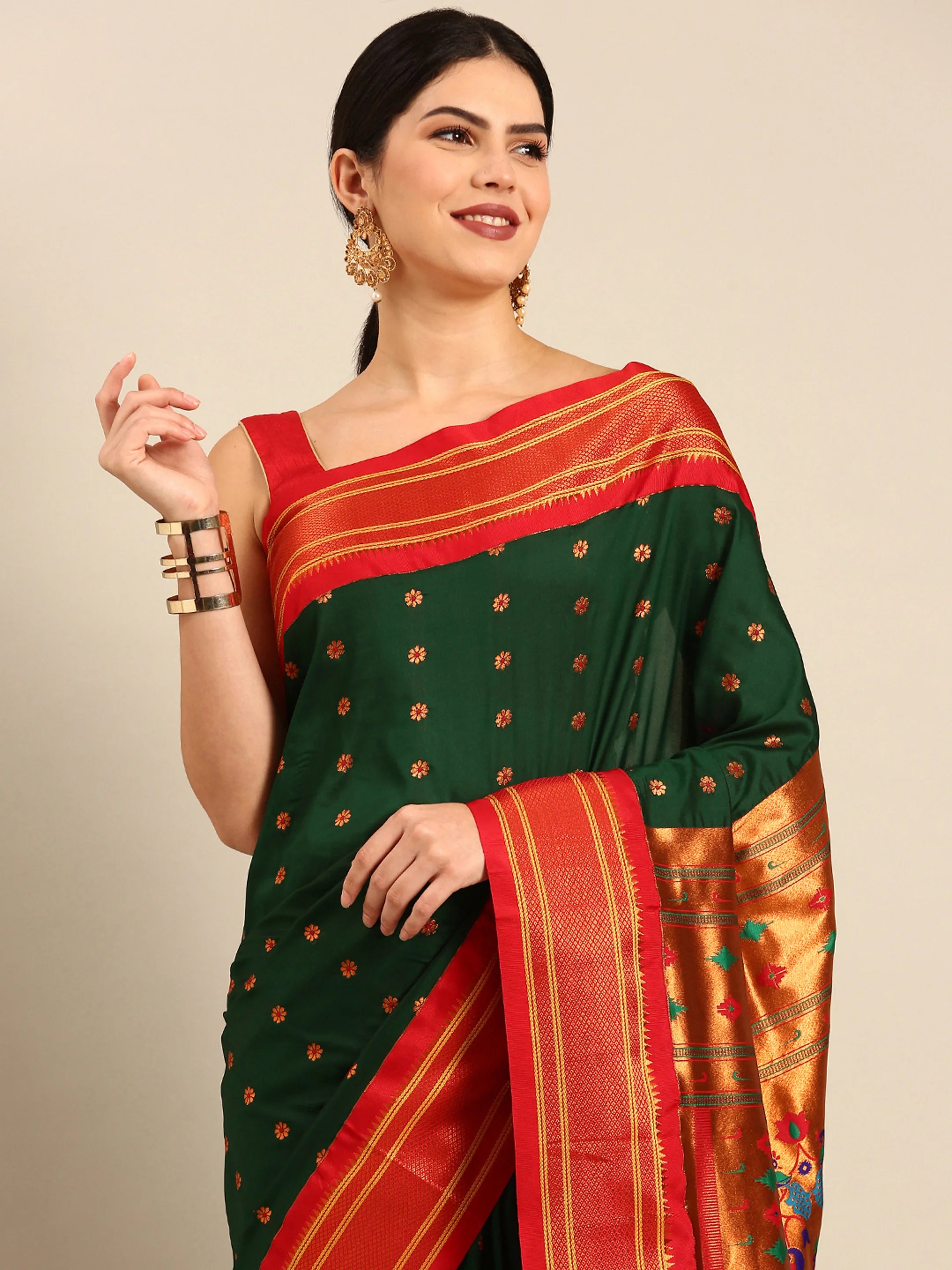 Muniya paithani saree silk blend in bottle green and red with floral meena butti - closeup view showing fabric and zari work for wedding wear