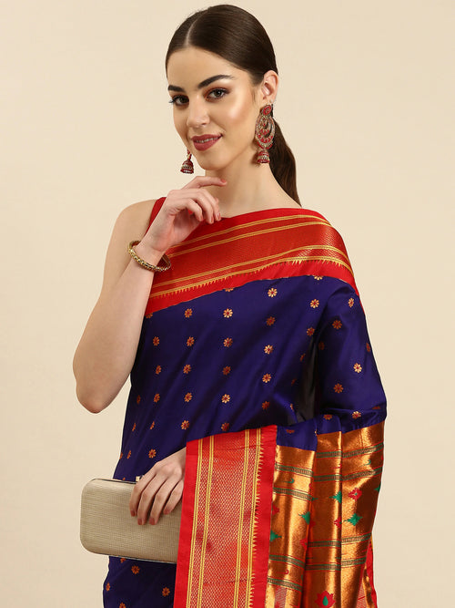Muniya paithani saree soft silk in indigo blue and red with floral meena butti - closeup view showing fabric and zari work for wedding wear