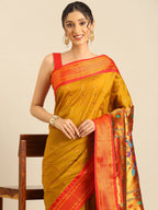 Muniya paithani saree silk blend in khaki and red with floral meena butti - closeup view showing fabric and zari work for wedding wear