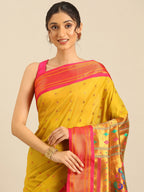 Muniya paithani saree silk blend in mustard yellow and pink with floral meena butti - closeup view showing fabric and zari work for wedding wear