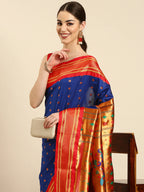 Muniya paithani saree silk blend in royal blue and red with floral meena butti - closeup view showing fabric and zari work for wedding wear