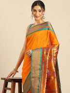 Muniya paithani saree silk blend in saffron and rama with floral meena butti - closeup view showing fabric and zari work for wedding wear