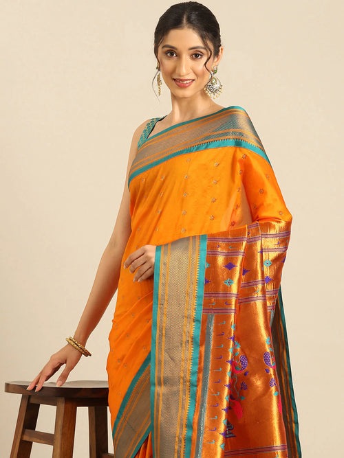Muniya paithani saree soft silk in saffron and rama with floral meena butti - closeup view showing fabric and zari work for wedding wear