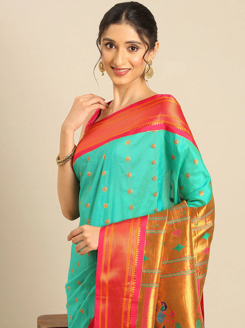 Muniya paithani saree soft silk in sea green and pink with floral meena butti - closeup view showing fabric and zari work for wedding wear
