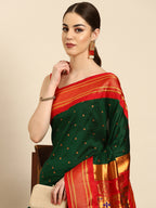 Maharani paithani saree silk blend in bottle green & red with polka butta design - closeup view for weading party and festival