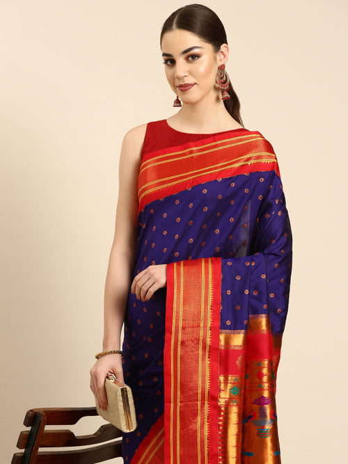 Double pallu paithani saree soft silk in indigo blue and red with chakra phool meena butti - closeup view showing fabric and zari work for party wear