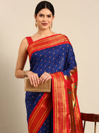 Double pallu paithani saree silk blend in royal blue and red with chakra phool meena butti - closeup view showing fabric and zari work for party wear