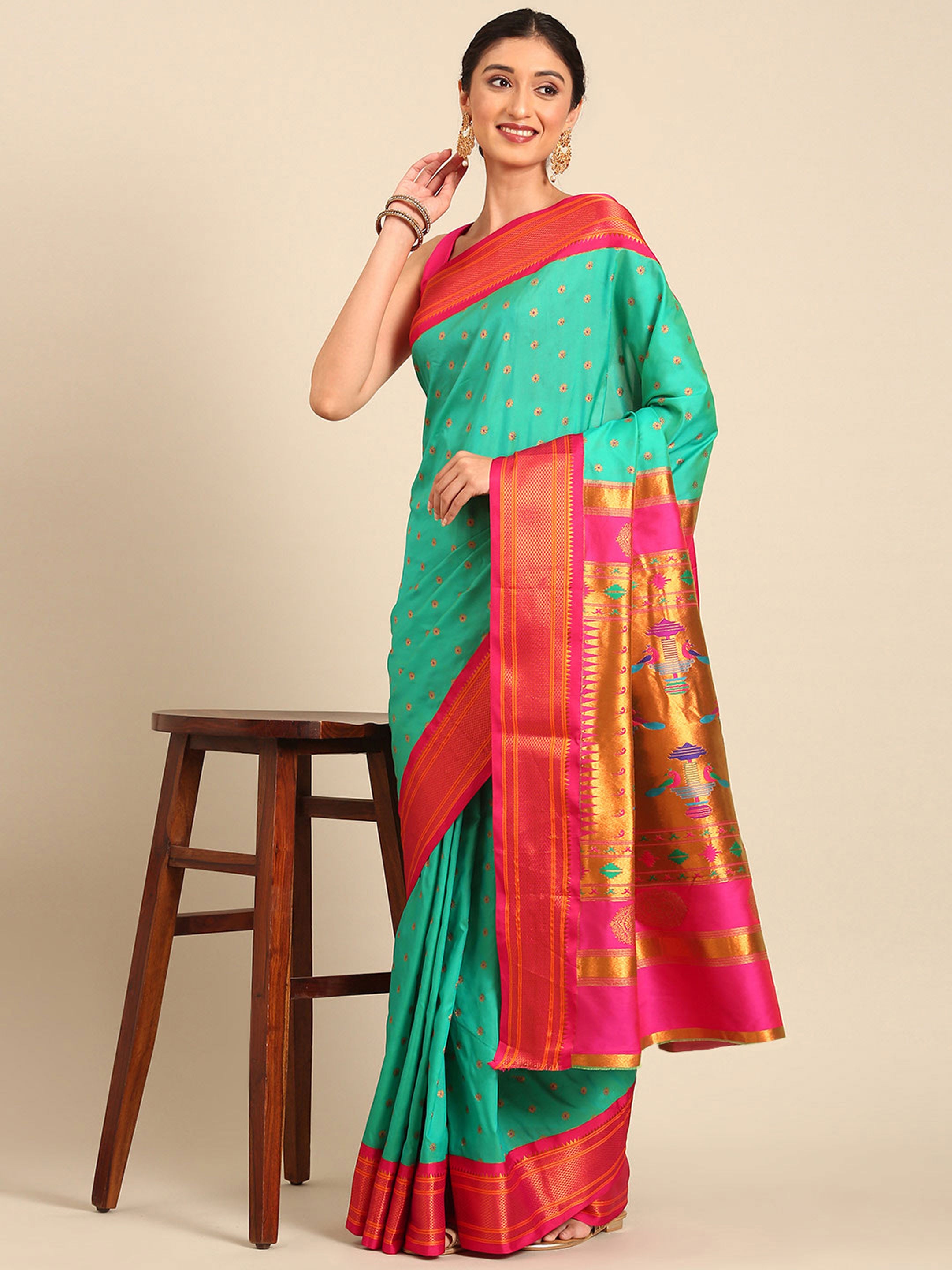 Double pallu paithani saree silk blend in sea green and pink with chakra phool meena butti - styled model view for party wear