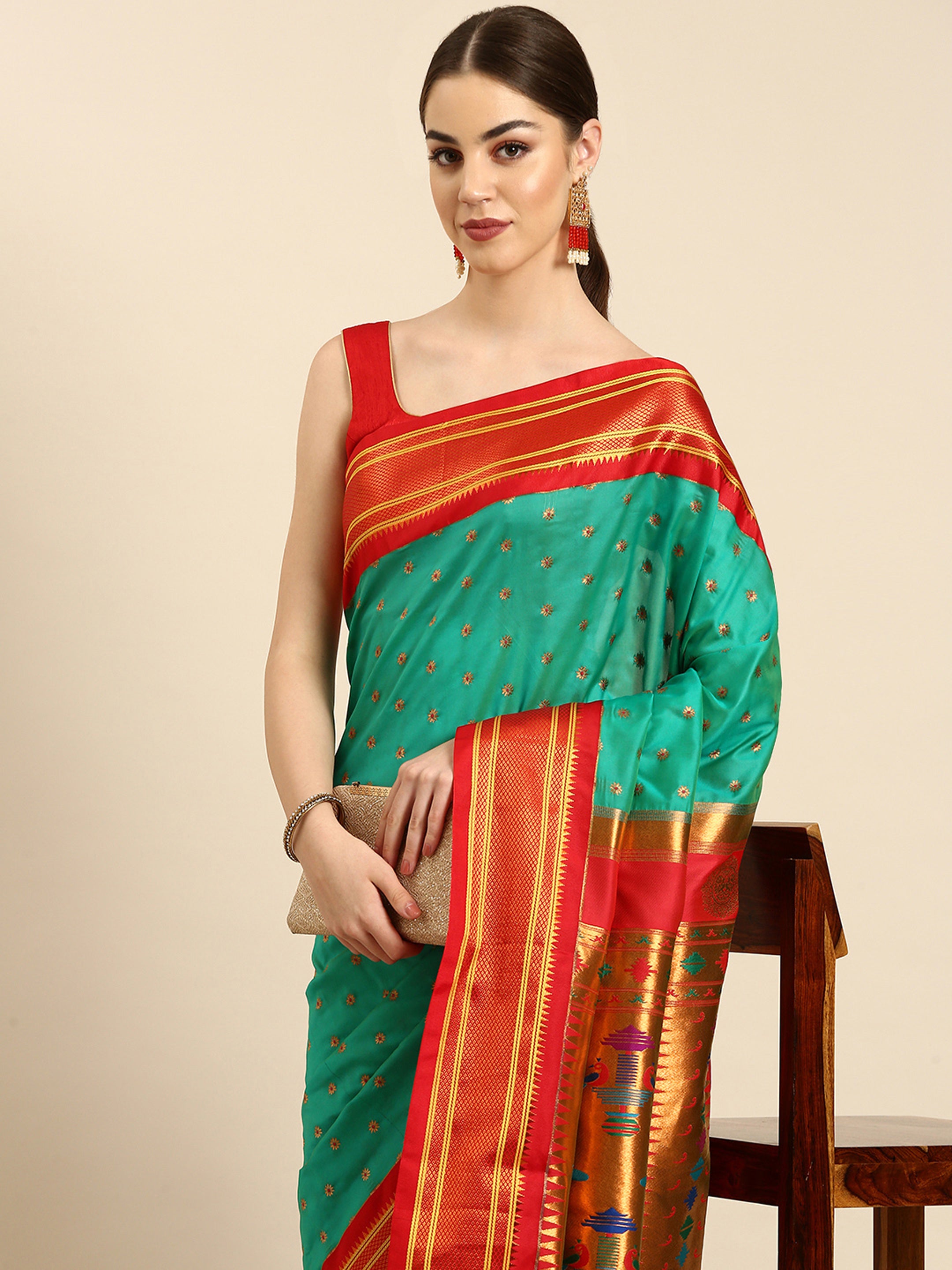 Double pallu paithani saree silk blend in sea green and red with chakra phool meena butti - closeup view showing fabric and zari work for party wear