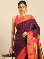 Double pallu paithani saree silk blend in wine and pink with chakra phool meena butti - closeup view showing fabric and zari work for party wear