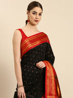 Double pallu paithani saree silk blend in black and red with zari star butti - closeup view showing fabric and zari work for wedding wear