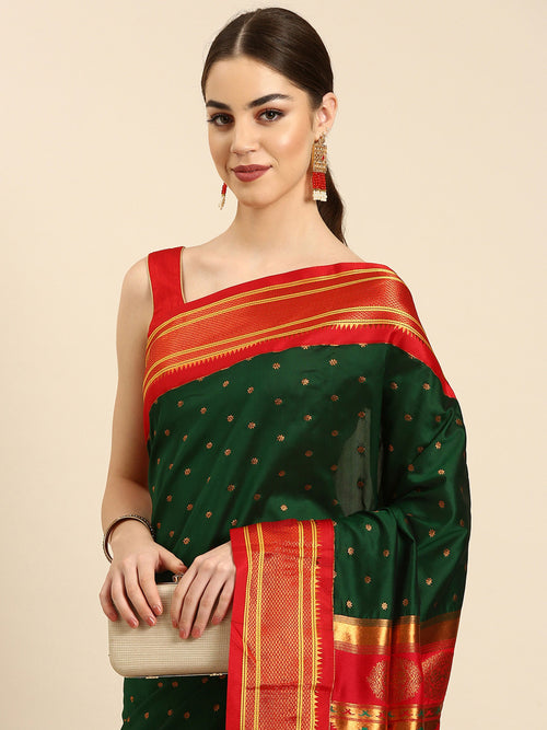 Double pallu paithani saree soft silk in bottle green and red with zari star butti - closeup view showing fabric and zari work for wedding wear