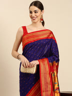 Double pallu paithani saree silk blend in indigo blue and red with zari star butti - closeup view showing fabric and zari work for wedding wear
