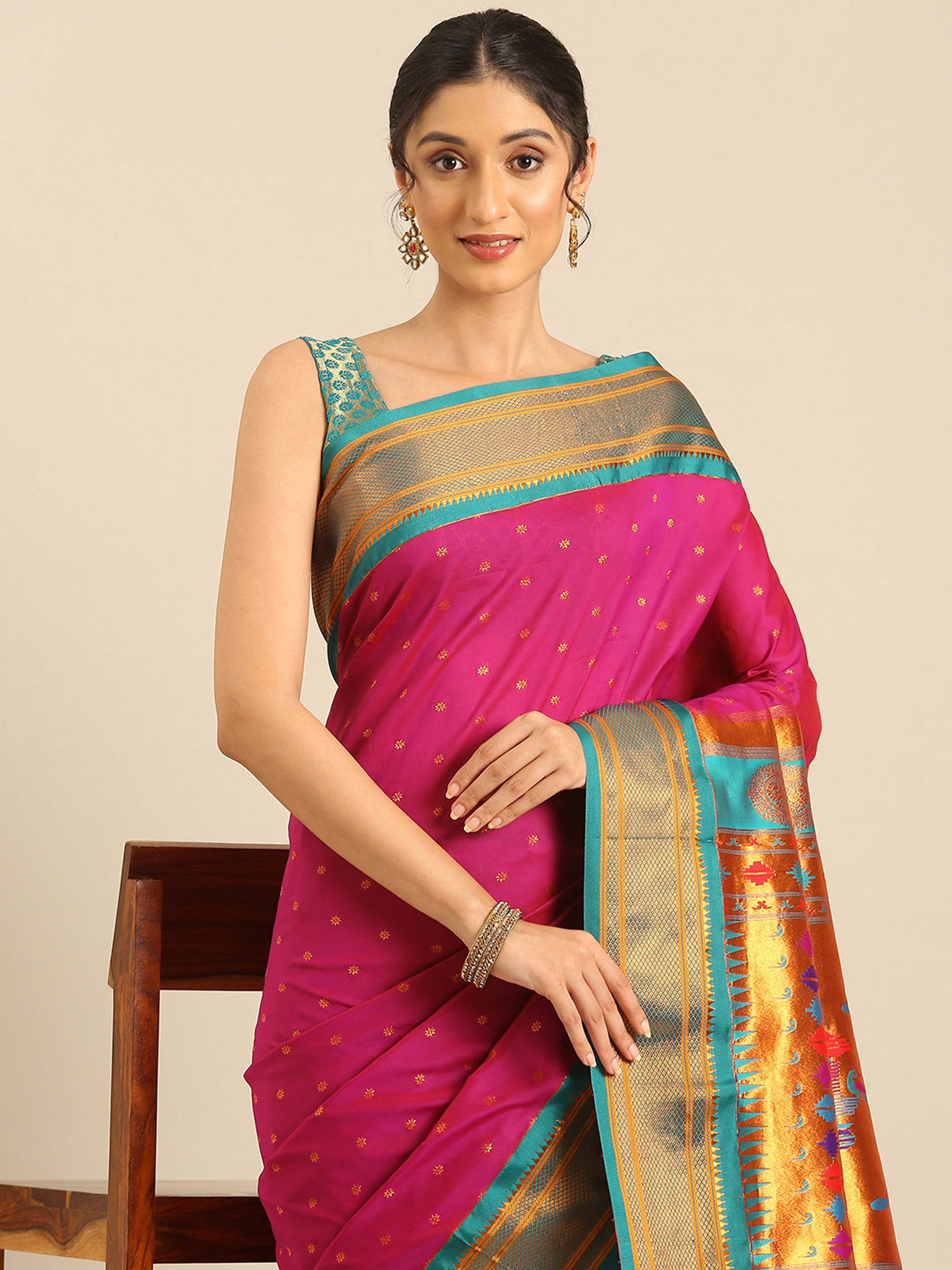Double pallu paithani saree silk blend in magenta and rama with zari star butti - closeup view showing fabric and zari work for wedding wear
