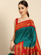 Double pallu paithani saree silk blend in rama green and red with zari star butti - closeup view showing fabric and zari work for wedding wear