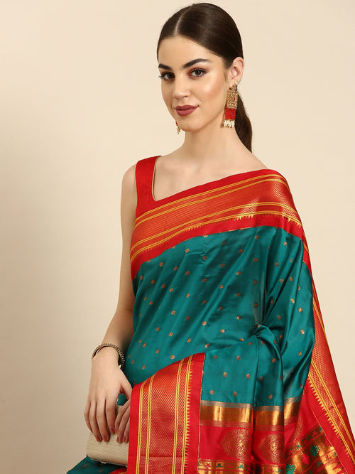 Double pallu paithani saree soft silk in rama green and red with zari star butti - closeup view showing fabric and zari work for wedding wear