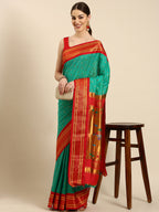Double pallu paithani saree silk blend in sea green and red with zari star butti - front view for wedding wear