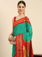 Double pallu paithani saree silk blend in sea green and red with zari star butti - closeup view showing fabric and zari work for wedding wear